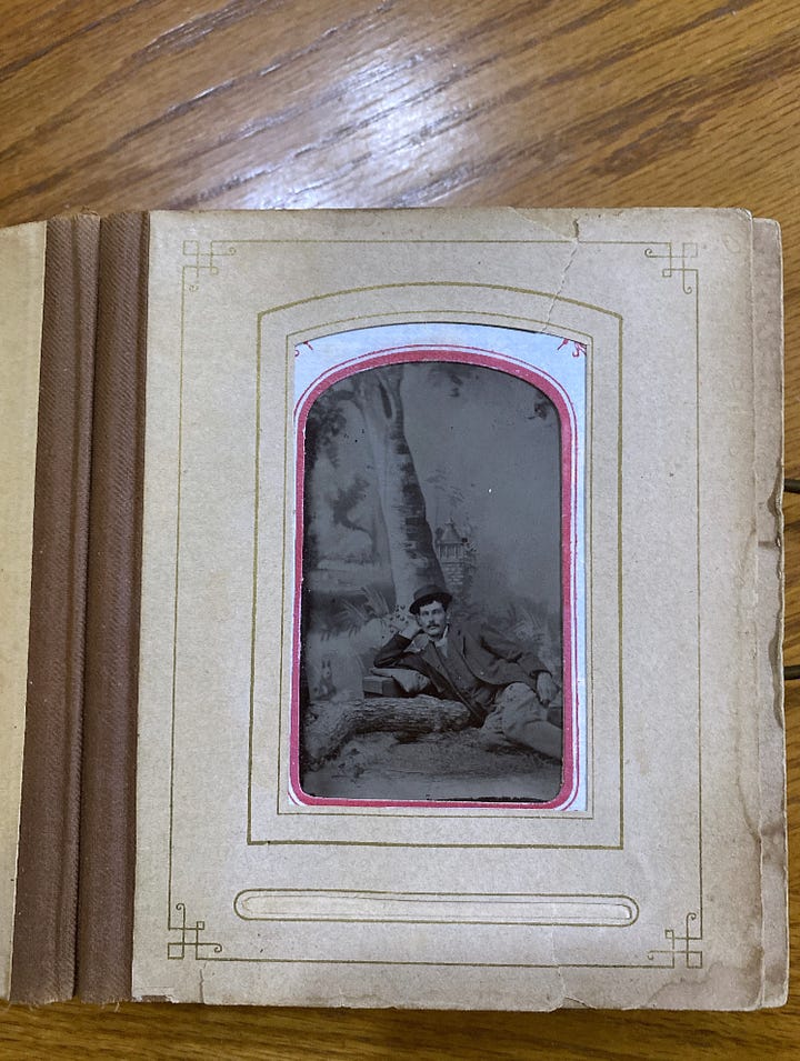 Old, leather covered album of tintype photographs