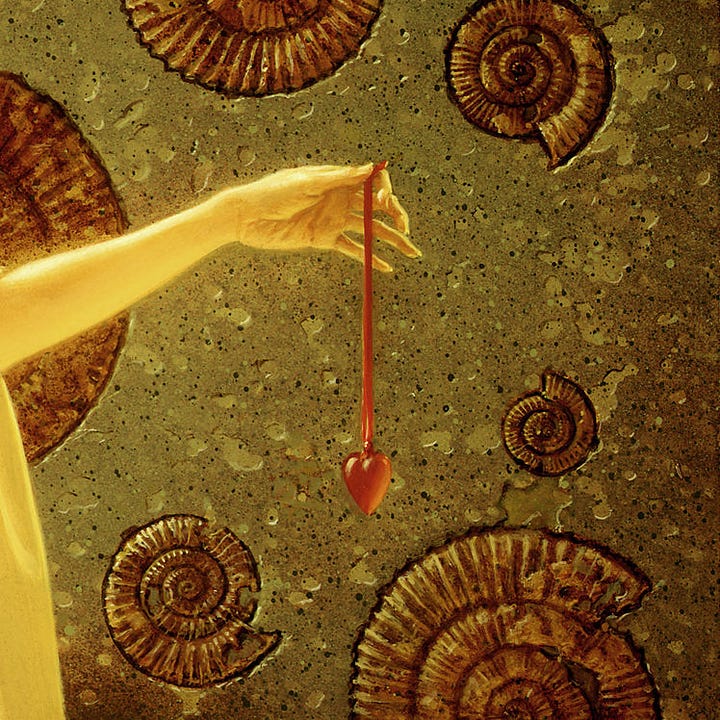 LEFT: Detail of women holding at arm's length a red glass heart dangling on a ribbon. RIGHT: Close detail of red glass heart dangling from a ribbon