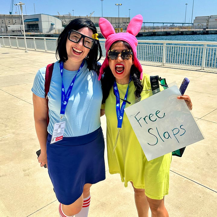 Alyssa dressed as Tina Belcher from Bob's Burgers, posing with her husband Tom as Jimmy Jr. and another fan dressed as Louise