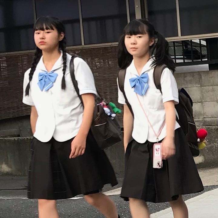 Japanese school girls on their way home from school and a tatami room fit for poetry.