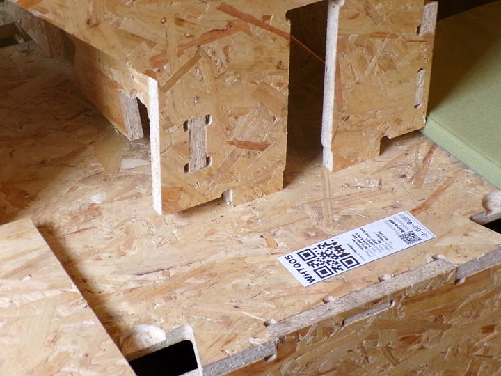 WIkiHouse parts being assembled into a small structure