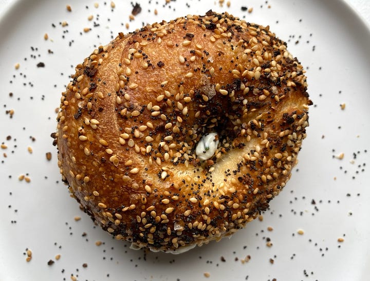 The top of the plain bagel and everything bagel