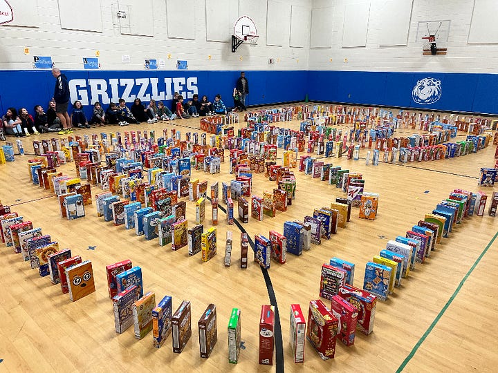 Donated cereal boxes are set up in the Grafton Village Elementary School gym. Right: fifth grade students load the boxes onto pallets for pickup by the Fredericksburg Regional Food Bank.