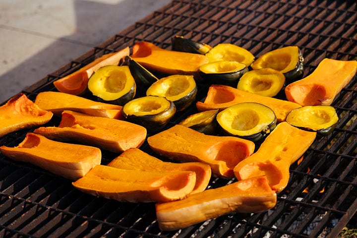 Clockwise from upper left: two men in front of open flame grill; man grilling on open flame; bison steaks on grill; squash on grill