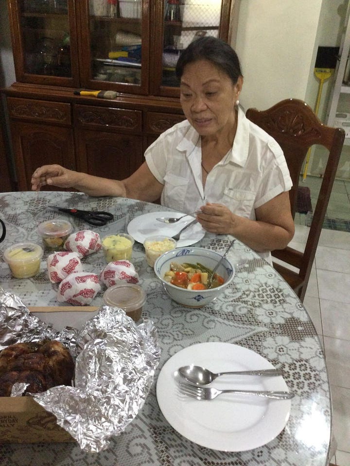 Two photos of my aunt sitting in the dining room celebrating her birthday