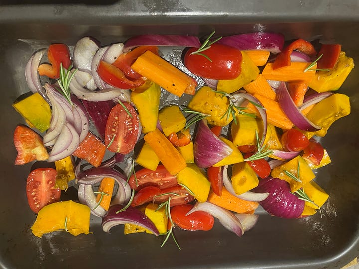 Roast pumpkin, cherry tomatoes, carrots, red pepper, red onion, and rosemary.