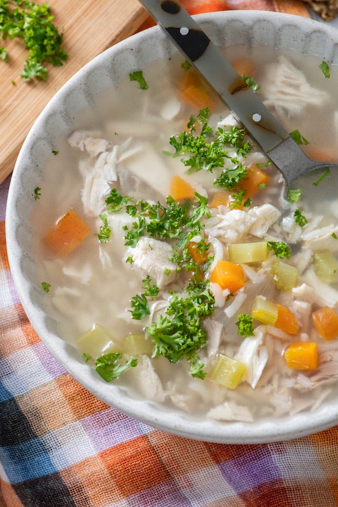 Image 1: potato pancakes (latkes) with sour cream and small bowl of applesauce; Image 2: bowl of chicken soup with carrots, celery, and parsley 