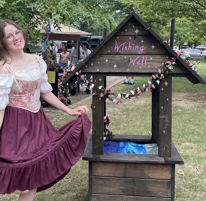 4 photos, first is author Naomi Novik on a zoom interview. Second is a person in medieval metal armor wielding an axe. Third is Marty next to a hand-made wooden wishing well. Fourth is a room of children and parents at craft time.