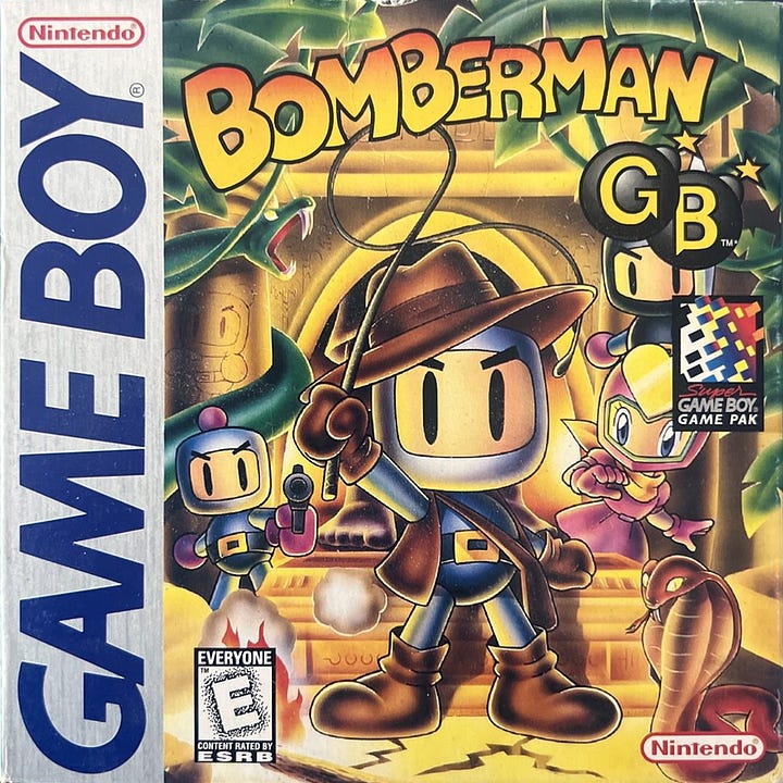 On the left, the North American box art for Bomberman GB, and on the right, the box art for Bomberman GB 2 in Japan. They're actually the same box art, albeit with regional differences in box framing and logo placements, but the names are different due to release histories in the two regions. In both, the central figure is an Indiana Jones-style Bomberman with a whip, and, of course, snakes. It had to be snakes.