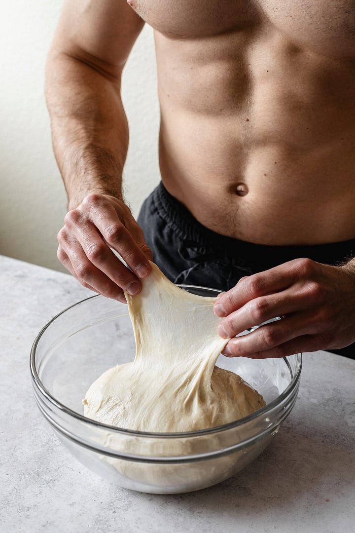 Shirtless man making vegan plant milk bread dough