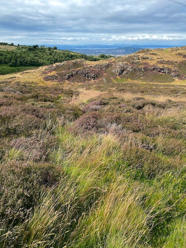 Similar images of green hills and blue skies from Nicaragua and Scotland.