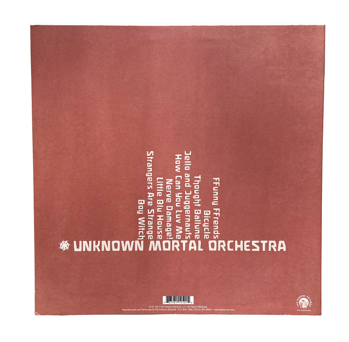 the front and back covers for UMO's debut album. the first picture is a fun architectural piece captured in front of a clear blue sky. the back cover includes the tracklist in white text on a dusty rose background.