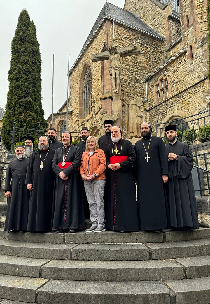 Elke with bishops and priests