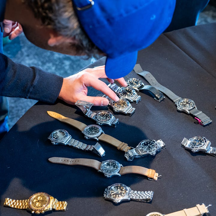 pile and table of vintage watches