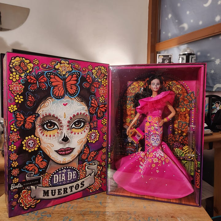 A photo with Dia de Muertos Barbie