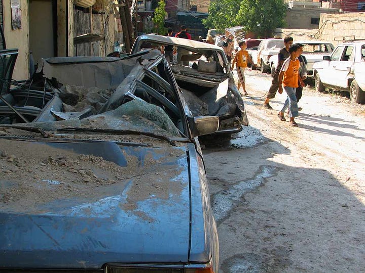 Palestinian residents assess damage after Israeli strike in Ain-al Hilweh shortly before ceasefire