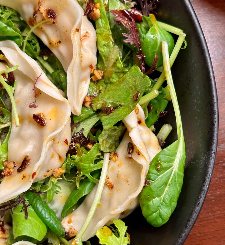 Assembling a dumpling salad