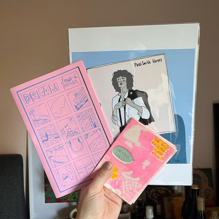 Me holding up some of my favorite zines purchased at Wasted Ink Zine Distro or Phoenix Zine Fest