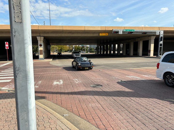 Broken sidewalk and freeway crossing.