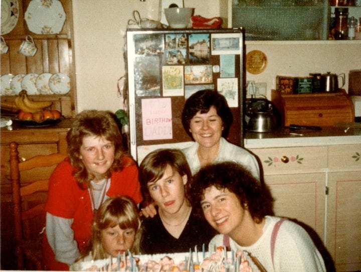 Women and childresn with a birthday cake