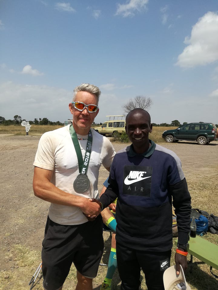 Simon Hollis with marathon record holder Eliud Kipchoge, and at a checkpoint in a race in the Himalayas