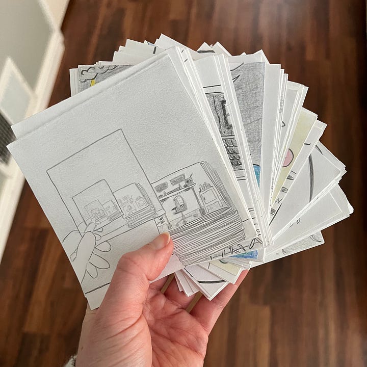 The image on the left shows all 100 drawings fanned out from an overhead perspective. The drawing on the right shows the drawings in a neat stack from the side view.