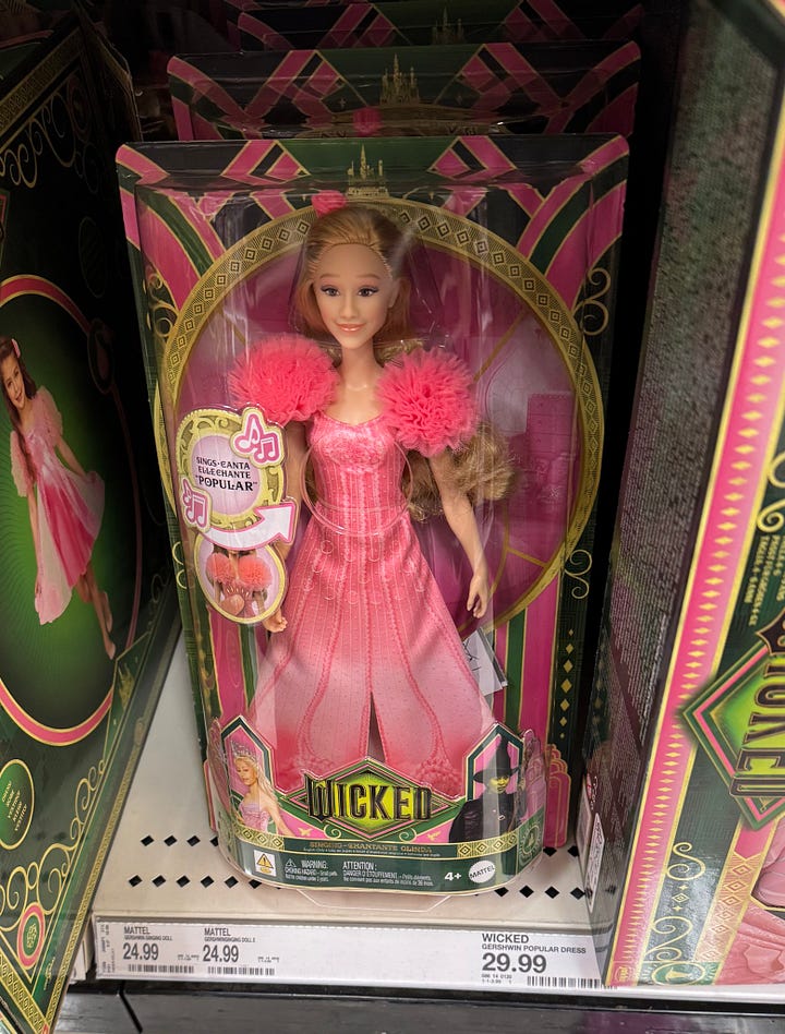 Photos of the front and back sides of the packaging of Mattel's Glinda doll, a character from the movie Wicked, via just2good (Sarah Genao) / Twitter