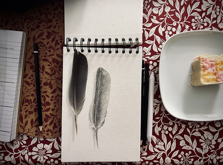 A loose marker landscape with blues and greens, two line portraits of my daughters, a realistic drawing of a feather with a real feather on top 