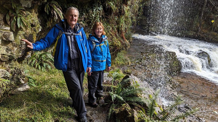 two hikers in the waterfalls area of the brecon beacons