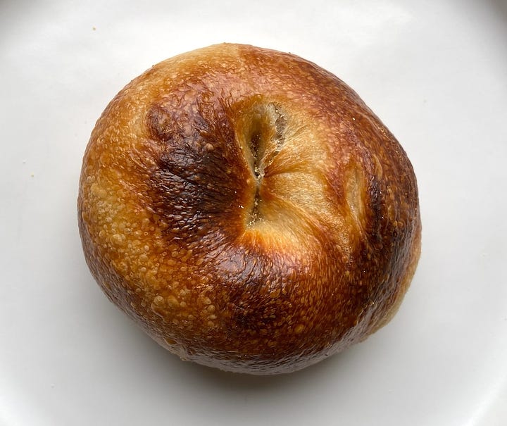 The top of the plain bagel and everything bagel