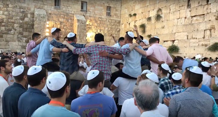Sabbath dancing at the Western Wall. Image not mine, iPhones didn't exist when I lived there.