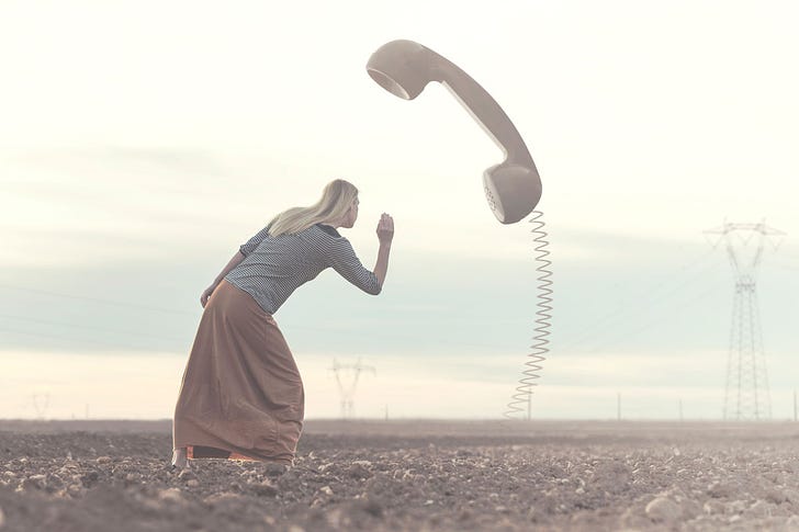 Woman Listening to Giant Phone