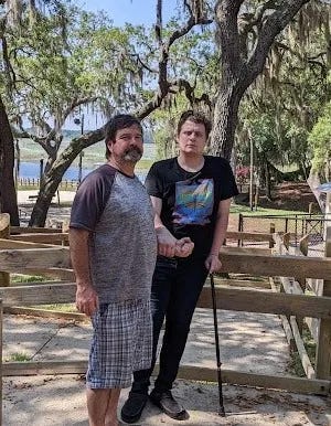 Cody, with his dad. For the first eight months after hospitalization, Cody needed a cane and needed to hold onto someone to walk at any distance