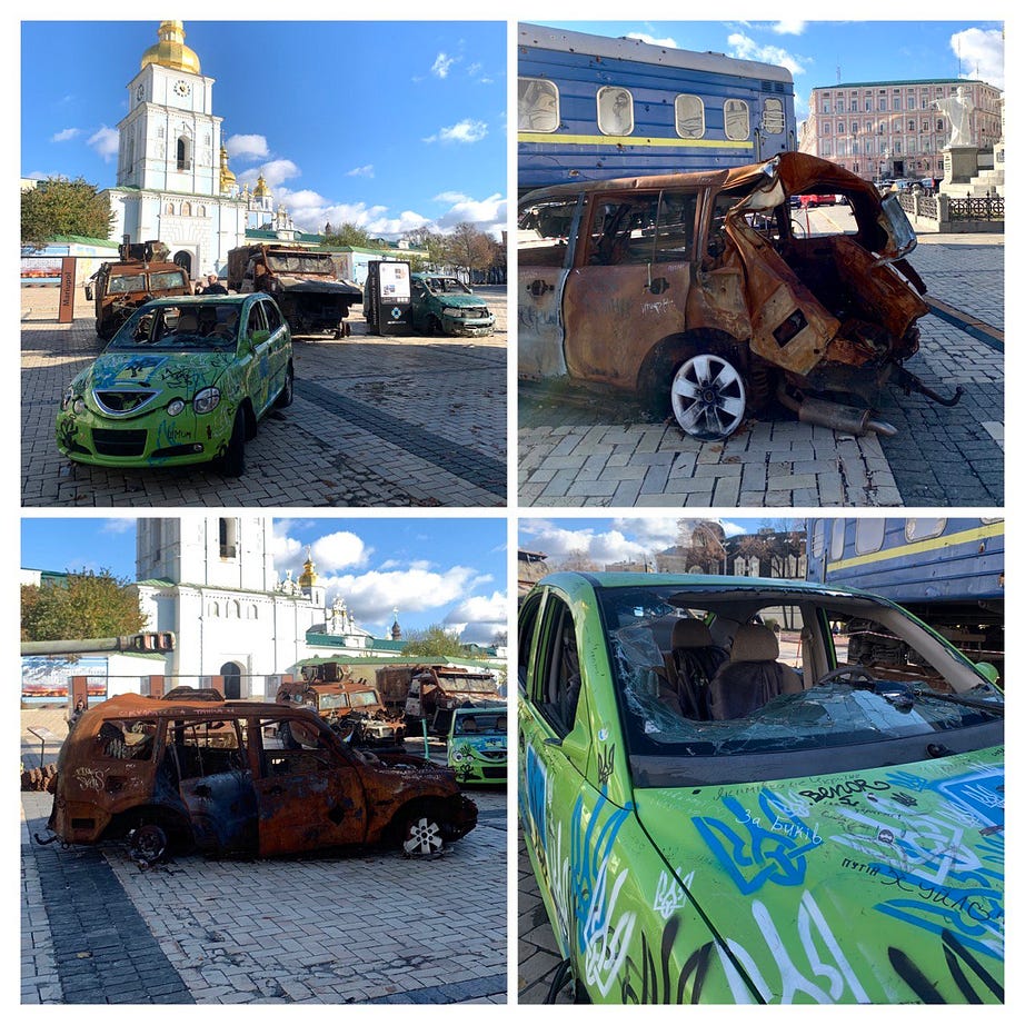 Destroyed civilian cars at Mykhailivska Square