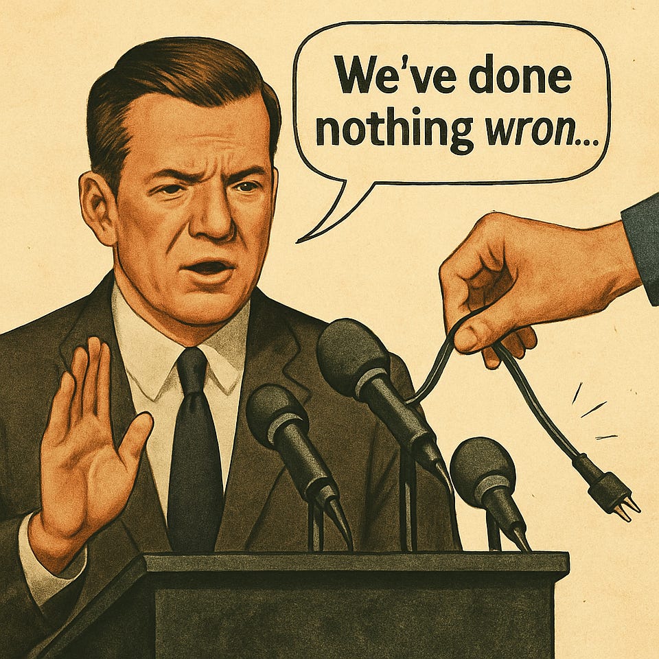Cartoon: an official at a podium says “We’ve done nothing wron…” as a hand pulls his microphone’s plug