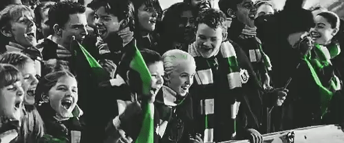 Harry Potter's Slytherin students cheering with excitement