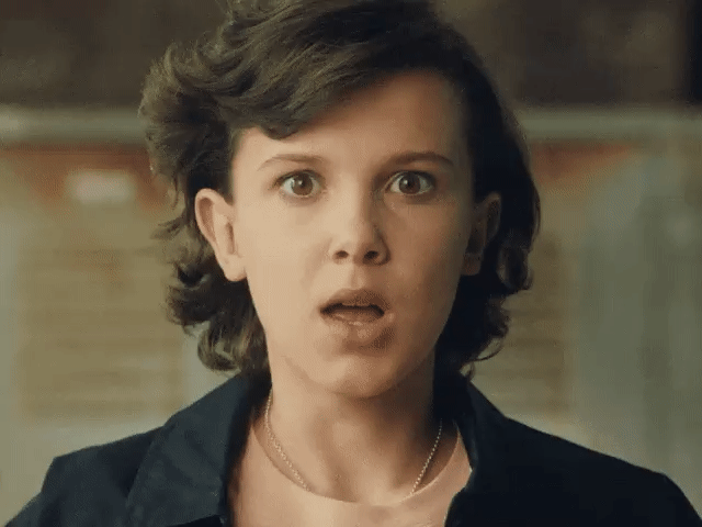 Millie Bobby Brown, most known for playing eleven in Stranger Things, mimicking an explosion in her mind using her hands.